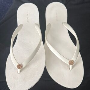 Tory Burch white flip flopswith Gold Accent worn once!
